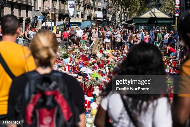 People display flowers, candles, balloons and many objects to pay tribute to the victims of the Barcelona and Cambrils attacks on the Rambla...