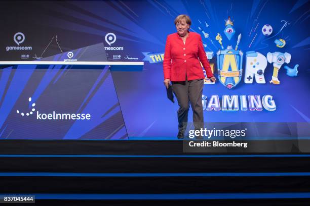 Angela Merkel, Germany's chancellor and Christian Democratic Union leader, departs the stage after officially opening the Gamescom video games trade...