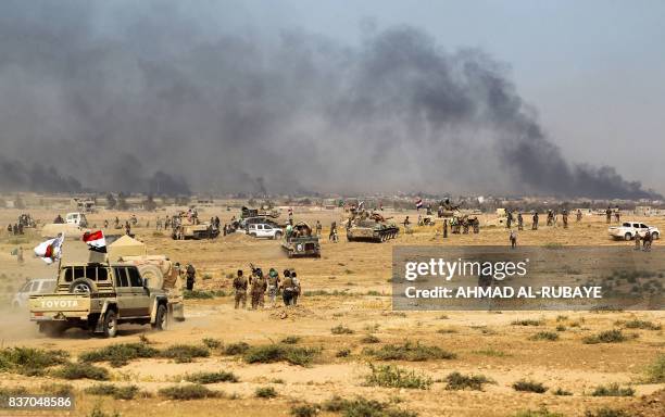 Iraqi forces backed by the Hashed Al-Shaabi advance towards the town of Tal Afar, west of Mosul, after the Iraqi government announced the beginning...