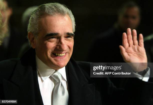 Movie director Martin Scorsese waves as he arrives at Rome's new Auditorium "The City of Music" late 11 January 2003 to attend the Italian premiere...