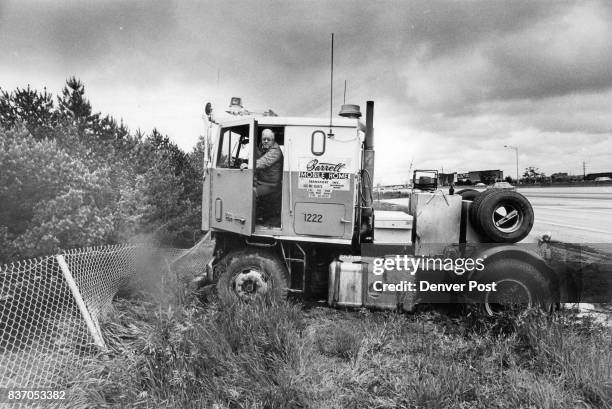 Truck driver Melvin Larson ponders what to do next after Losing control of his tractor Friday afternoon Larson 61, of 1557 S. Stuart St., was driving...