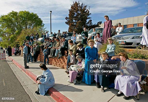 Several thousand polygamy supporters from Colorado City, Arizona sit across the street from the Fourth District Courthouse, November 14, 2008 in St....