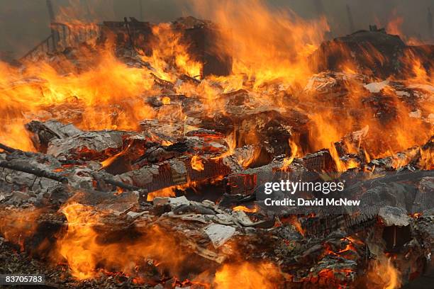 Large flames are blown from a burning mobile homes by strong wind as most of the homes in the Oakridge mobile home park, which reportedly has 600-800...