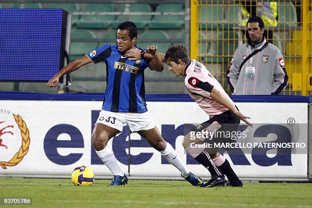 Inter Milan's forward Amantino Mancini of Brazil fights for the ball with Palermo's midfielder Maurizio Ciaramitaro during their serie A football...