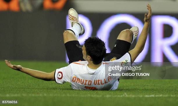 Valencia's David Villa reacts during their Spanish league football match against Sporting Gijon at Mestalla Stadium in Valencia, on November 15,...