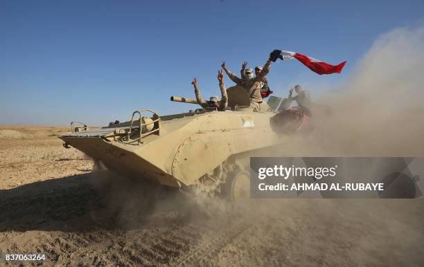Iraqi forces backed by the Hashed Al-Shaabi advance towards the town of Tal Afar, west of Mosul, after the Iraqi government announced the beginning...