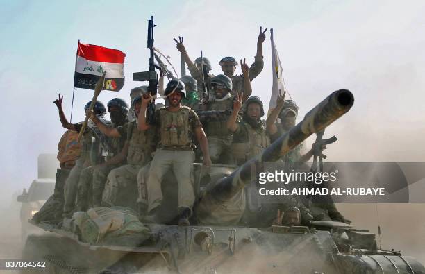Fighters of the Hashed Al-Shaabi advance towards the town of Tal Afar, west of Mosul, after the Iraqi government announced the beginning of the...