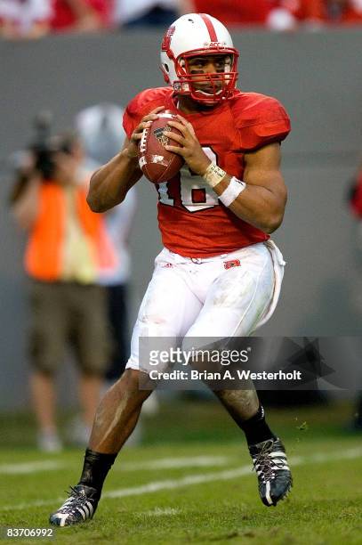 Russell Wilson of the North Carolina State Wolfpack drops back to pass during first half action versus the Wake Forest Demon Deacons at Carter Finley...