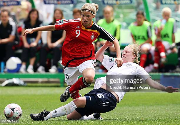 Gemma Bonner of England tackles Tabea Kemme of Germany during the FIFA U17 Women's World Cup Third and Fourth Playoff match between England and...