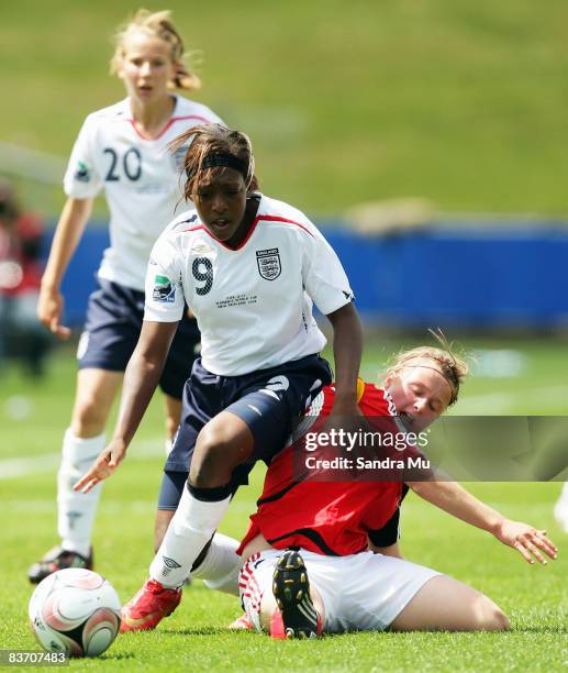 Danielle Carter of England is tackled by Claudia Goette of Germany during the FIFA U17 Women's World Cup Third and Fourth Playoff match between...