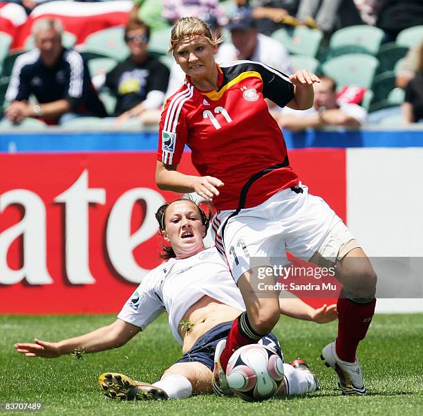 Lucy Bronze of England tackles Alexandra Popp of Germany during the FIFA U17 Women's World Cup Third and Fourth Playoff match between England and...