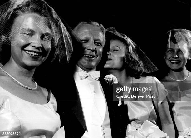 Francis Van Derbur receives teasing instructions from three of his pretty daughters Mrs. Robert Falkenberg of Kansas City, Mrs. Richard Knowlton of...