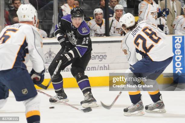 Greg Zanon and Ryan Jones of the Nashville Predators defends against Brian Boyle of the Los Angeles Kings during the game on November 15, 2008 at...