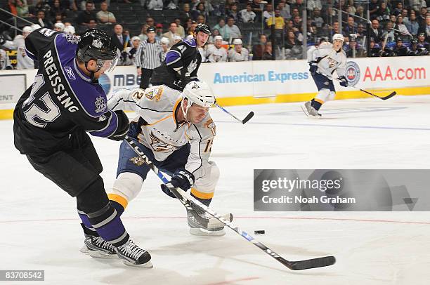 Scott Nichol of the Nashville Predators battles for the puck against Tom Preissing of the Los Angeles Kings during the game on November 15, 2008 at...