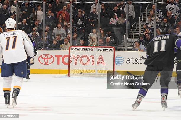 David Legwand of the Nashville Predators and Anze Kopitar of the Los Angeles Kings watch as the puck rolls into the empty net in the third period...