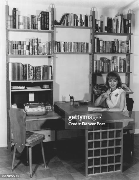 The wall unit shown here with actress Charlene Holt provides an amazing amount of storage space and at the same time is a decorative accent for the...