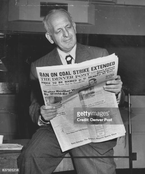 Gabriel Heatter, Kfel-Mutual network news analyst, looks over a copy of The Denver Post, to get background material of his special salute to The Post...