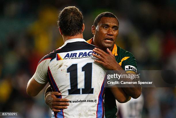 Petero Civoniceva of the Kangaroos embraces Ashton Sims of Fiji after winning the 2008 Rugby League World Cup Semi Final match between the Australian...