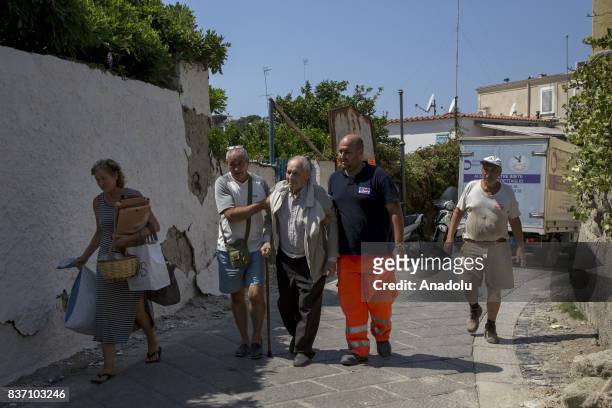 Rescuers evacuate an old man after 4.0-magnitude richter scale earthquake hit Ischia Island's Casamicciola Terme of Naples, Italy on August 22, 2017.