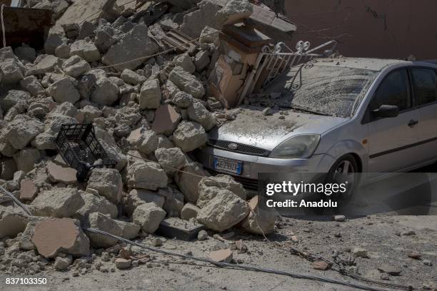 Wrecked car is seen under the debris of collapsed buildings after 4.0-magnitude richter scale earthquake hit Ischia Island's Casamicciola Terme of...