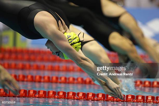 Marieke Guehrer of Australia jumps into the water during the heats of the women's 50m butterfly event at the FINA short course swimming World Cup...