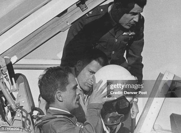 King Hussein At Controls King Hussein of Jordan dons helmet for flight in T38 jet at Buckley field in Denver as Maj. Saleh Al-Kurdi of the Jodanian...