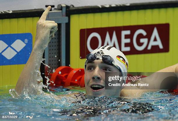 Marco Koch of Germany celebrates during the final of the men's 100m breaststroke event at the FINA short course swimming World Cup final on November...