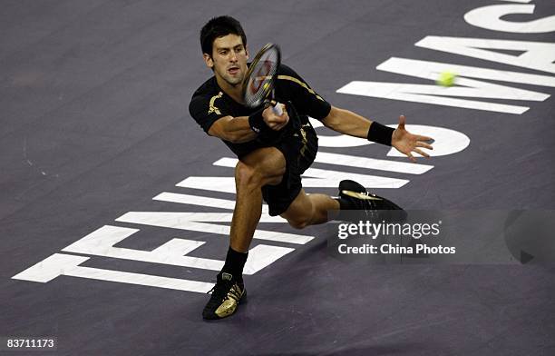 Novak Djokovic of Serbia hits a return against Nikolay Davydenko of Russia during the men's singles final match in the Tennis Masters Cup held at Qi...