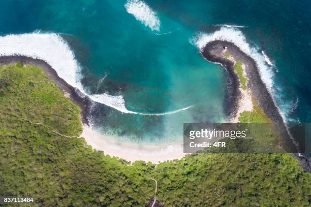 aerial view of the beautiful playa punta carola beach, san cristobal, galapagos islands, ecuador - ecuador stock pictures, royalty-free photos & images