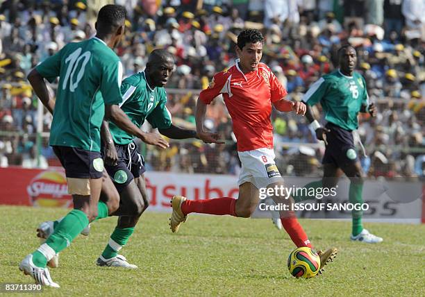 Egyptian Al-Ahly club player Mohamed Barakat Ahmed Bastamy fights for the ball with Oumarou Sanda during their African Champions League Cup final...