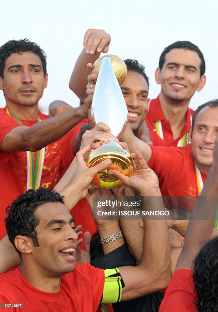 Egypt's Al-Ahly players hold the African