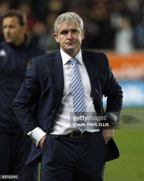 Manchester City manager Mark Hughes leaves the field after the English Premier League football match against Hull City at The Kingston Communications...