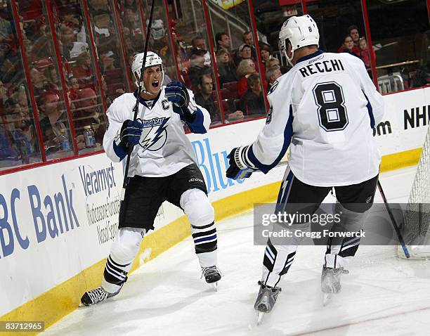 Vincent Lecavalier of the Tampa Bay Lightning celebrates his second period goal with teammate Mark Recchi during a NHL game against the Carolina...