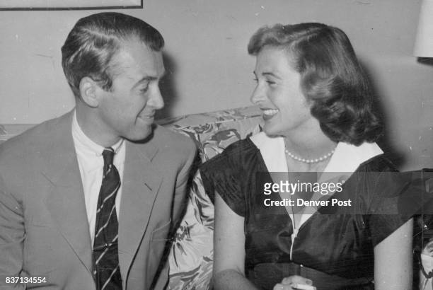 Jimmy Stewart, movie star, and his bride, the former Gloria Hatrick McLean, relax in their suite at the Broadmoor hotel, Colorado Springs, after...