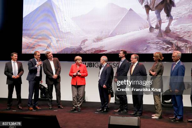 German Chancellor Angela Merkel, Felix Falk, Armin Laschet, Henriette Reker, Sean Casey, Gerald Boese visit the Ubisoft stand with Alain Corre, Ralf...