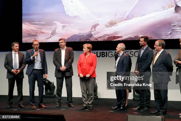 German Chancellor Angela Merkel, Felix Falk, Armin Laschet, Henriette Reker, Sean Casey, Gerald Boese visit the Ubisoft stand with Alain Corre, Ralf...