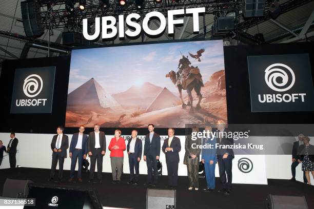 German Chancellor Angela Merkel, Felix Falk, Armin Laschet, Henriette Reker, Sean Casey, Gerald Boese visit the Ubisoft stand with Alain Corre, Ralf...