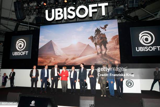 German Chancellor Angela Merkel, Felix Falk, Armin Laschet, Henriette Reker, Sean Casey, Gerald Boese visit the Ubisoft stand with Alain Corre, Ralf...