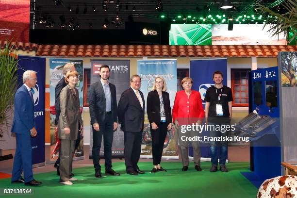 German Chancellor Angela Merkel, Sean Casey, Henriette Reker, Felix Falk and Armin Laschet visit the Nintendo Switch Edition Agricultural Simulator...