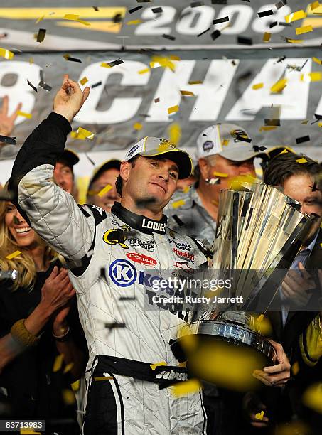 Jimmie Johnson, driver of the Lowe's/Kobalt Tools Chevrolet, celebrates after winning the 2008 NASCAR Sprint Cup Series Championship after the Ford...