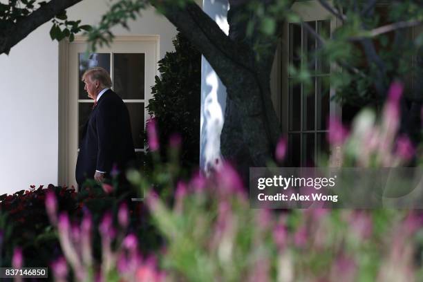 President Donald Trump comes out from the Oval Office prior to a departure from the White House August 22, 2017 in Washington, DC. President Trump...
