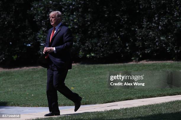 President Donald Trump walks towards the Marine One for a departure from the White House August 22, 2017 in Washington, DC. President Trump was...