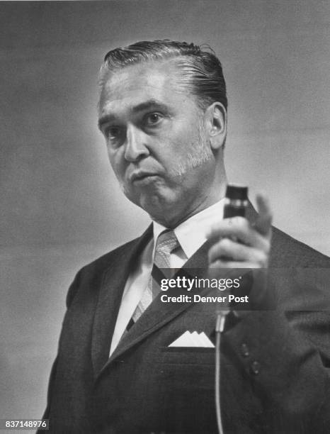 City Councilman Caldwell speaks to the crowd. He explained method of checking". Credit: Denver Post