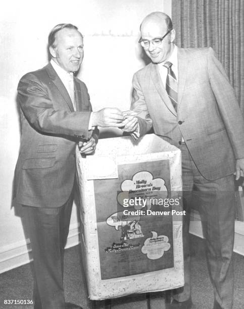 Molly Brown Sweepstakes Winners Selected Edward A. Batura, left, of Gano-Downs Co., chairman of the promotion committee of the Denver Retail...