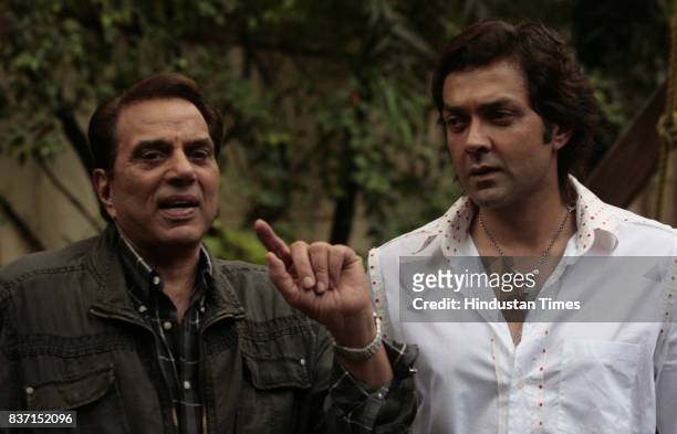 Bollywood actors Dharmendra and his son Bobby Deol celebrate 'Father's Day' during the promotional conference of 'Apne' in Mumbai on Sunday.