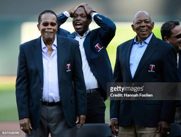 Hall of Fame player Rod Carew looks on with other former Minnesota Twins players Torii Hunter and Tony Oliva before the game between the Minnesota...