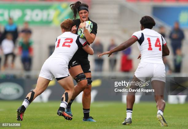 Charmaine Smith of New Zealand is tackled by Alev Kelter of the United States during the Women's Rugby World Cup 2017 Semi Final match between New...