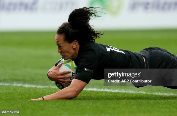 New Zealand's wing Portia Woodman scores heer team's second try during the Women's Rugby World Cup 2017 semi-final match between New Zealand and USA...