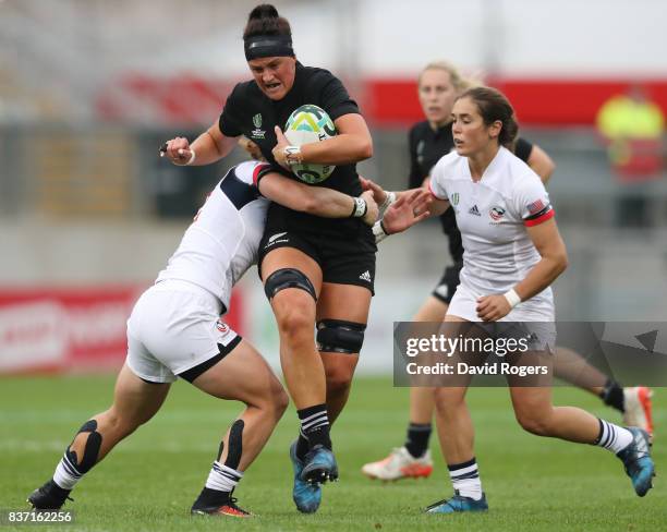 Charmaine Smith of New Zealand is tackled by Alev Kelter of the United States during the Women's Rugby World Cup 2017 Semi Final match between New...