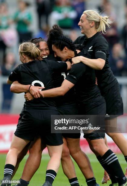 New Zealand players celebrate their second try scored by New Zealand's wing Portia Woodman during the Women's Rugby World Cup 2017 semi-final match...